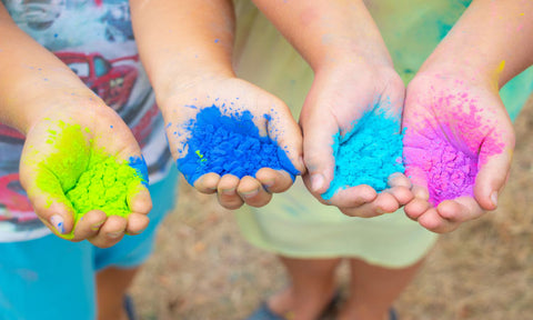 holi powder in hands for color run