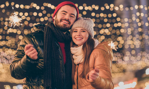 Couple enjoying sparklers during the holidays
