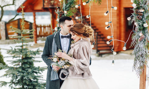newlywed couple taking in the beautiful winter wedding decor