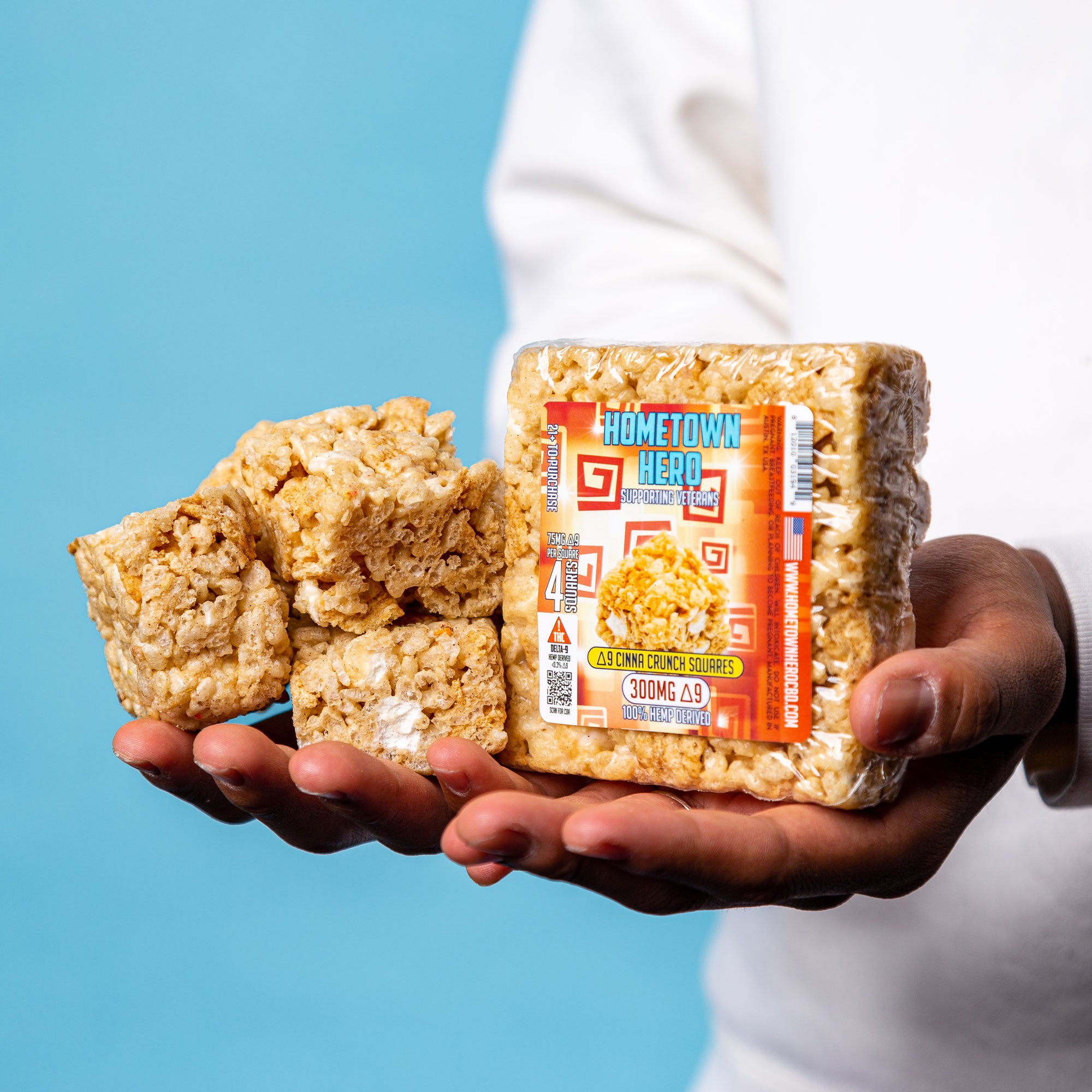 Buy 4 Get 1 FREE Delta 9 Cinna Crunch Squares with model (King) holding