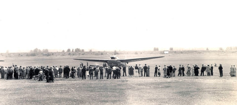 The world's first transpolar flight lands at Pearson Field on June 20, 1937. This image shows the ANT-25 at Pearson Field with crowd of people around it.