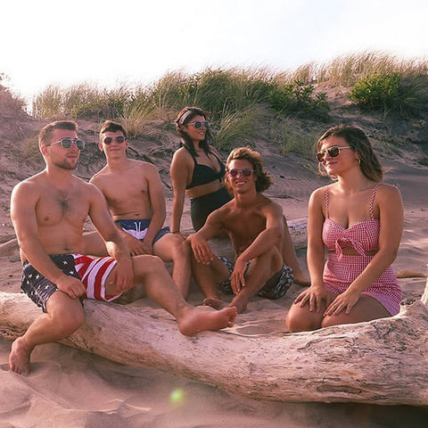 Group on the beach with AO Original Pilot polarized true-tone™ sunglass lenses eliminate glare providing better contrast