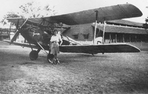 Amy standing next to her used Gipsy Moth named "Jason", the airplane she would fly from England to Australia in 1930, an 11,000 mile trip.