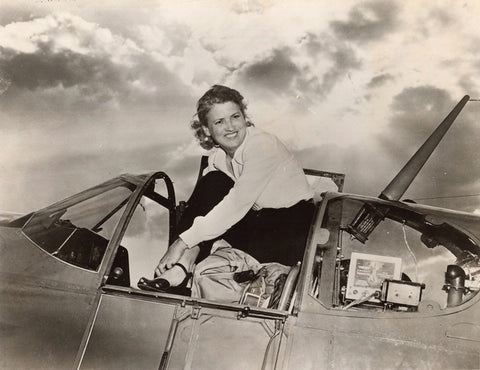 Jackie Cochran in the cockpit of her North American Aviation P-51B-15-NA Mustang NX28388, #13, at Cleveland Municipal Airport.