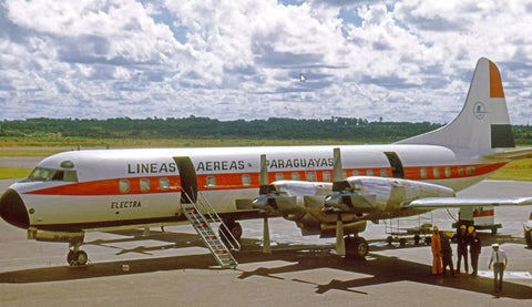 A LANSA Lockheed Electra L188 airplane being prepared for flight on the flight tarmac.