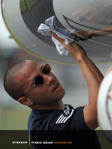 Thunderbird ground crewman wearing a pair of Scheyden Gold titanium frame sunglasses with mineral glass lenses with opticl clairty and no distortion.