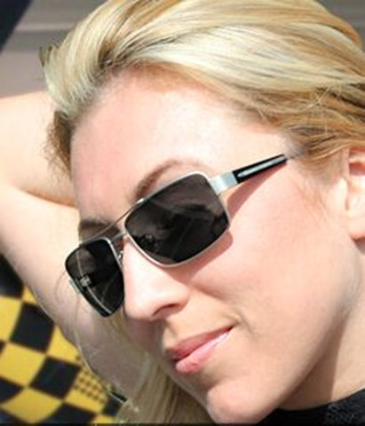 An attractove woman wearing a pair of Scheyden Fixed Gear Mustang lightweight aviator-style sunglasses with neutral gray mineral glass lenses.