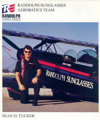 Sean D. Tucker with his aerobatic aircraft emblazoned with the Randolph Sunglasses logo.