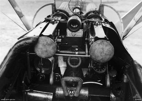 An image of the cockpit of a Sopwith Camel F.1 and it's two forward firing Vickers machine guns.