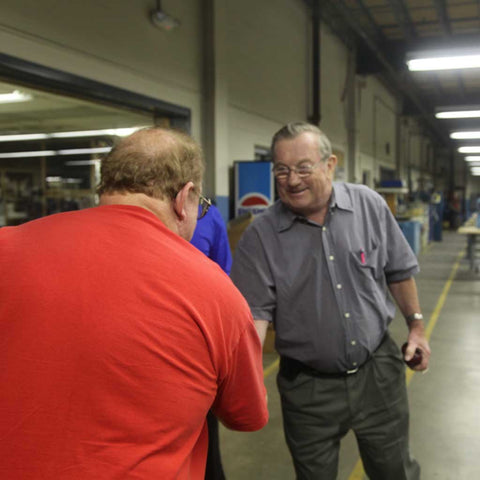 John M. White meets Stanley Zaleski at the Randolph manufacturing facility in Randolph, MA.