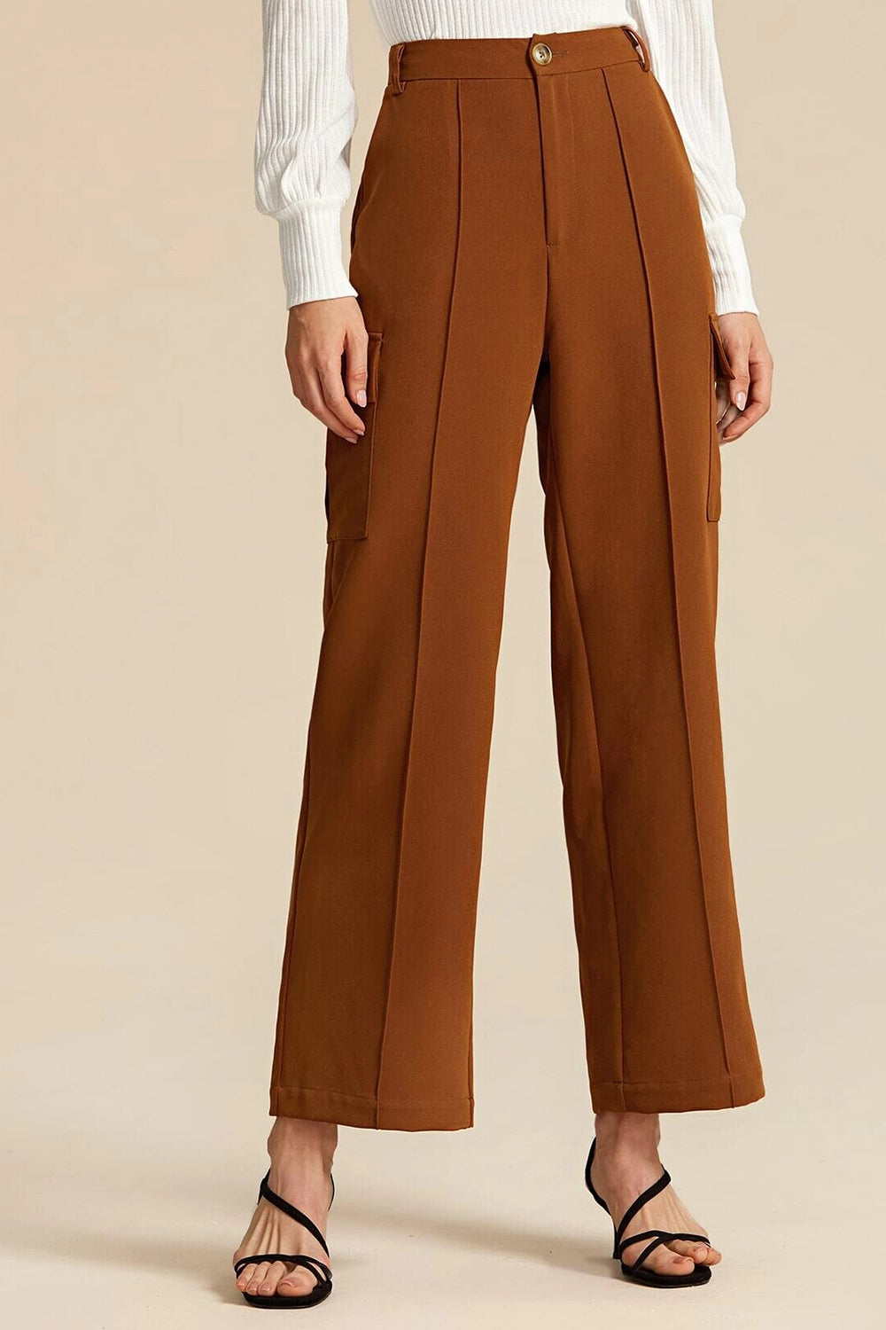 The front crease on pants was a different and new style for mens pants at  the time  Mens pants Pants Khaki pants