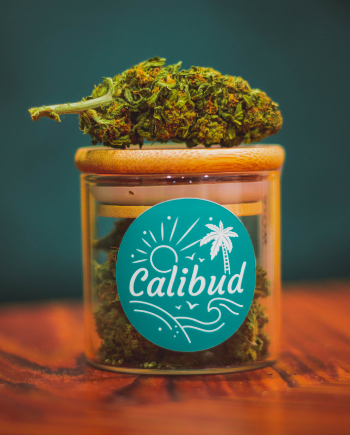 Image of a California Cannabis nug sitting on top of a jar of cannabis flower