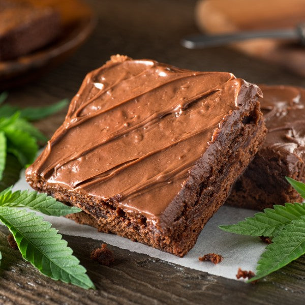 Image of a CBD infused brownies with cannabis leafs for decoration