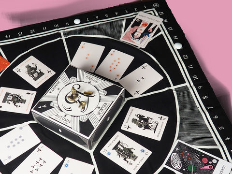 Illimat board set for play on a pink background