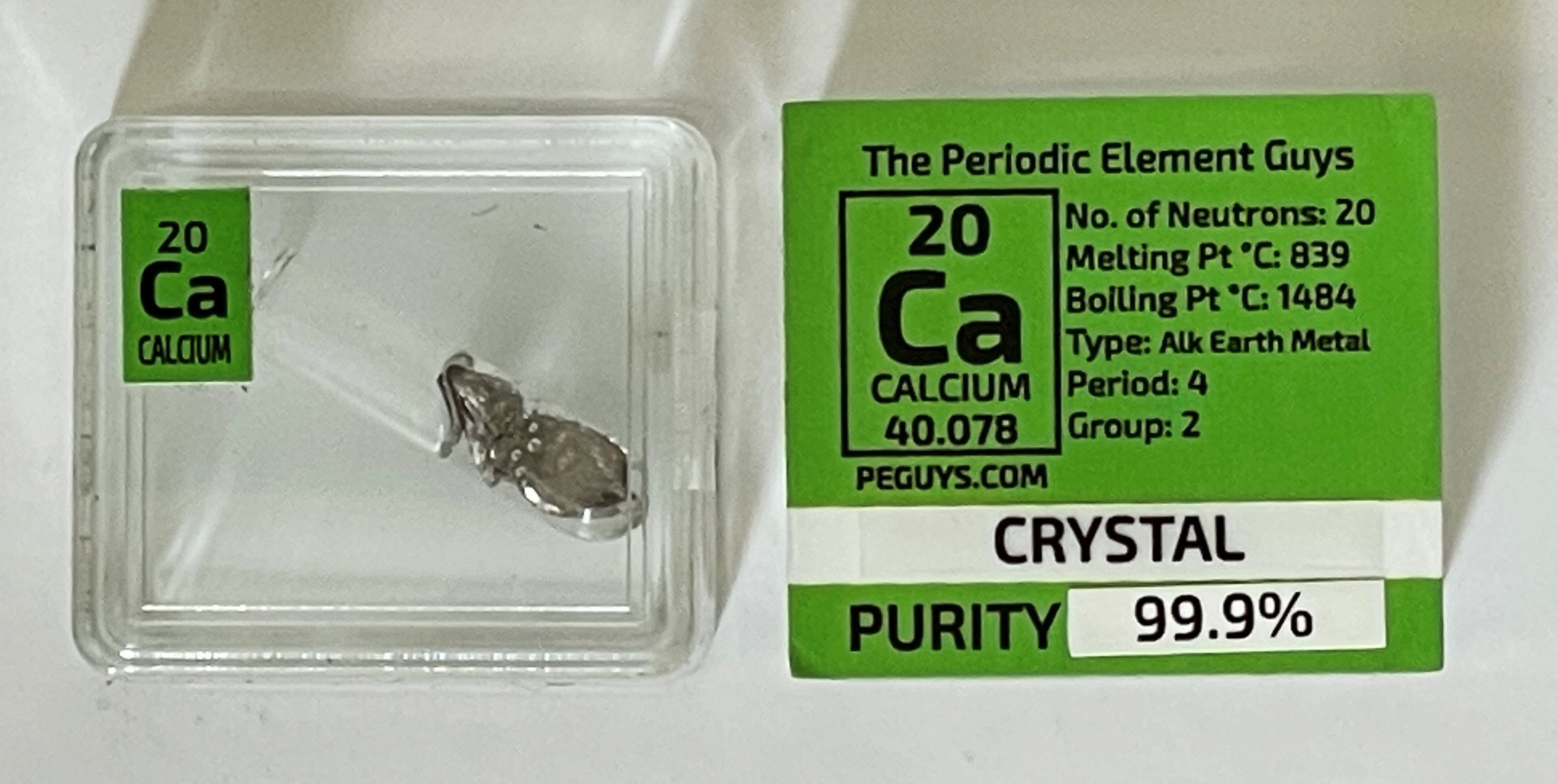 Calcium Metal Crystal 99.9% in oil in glass ampoule in a Periodic Element Tile