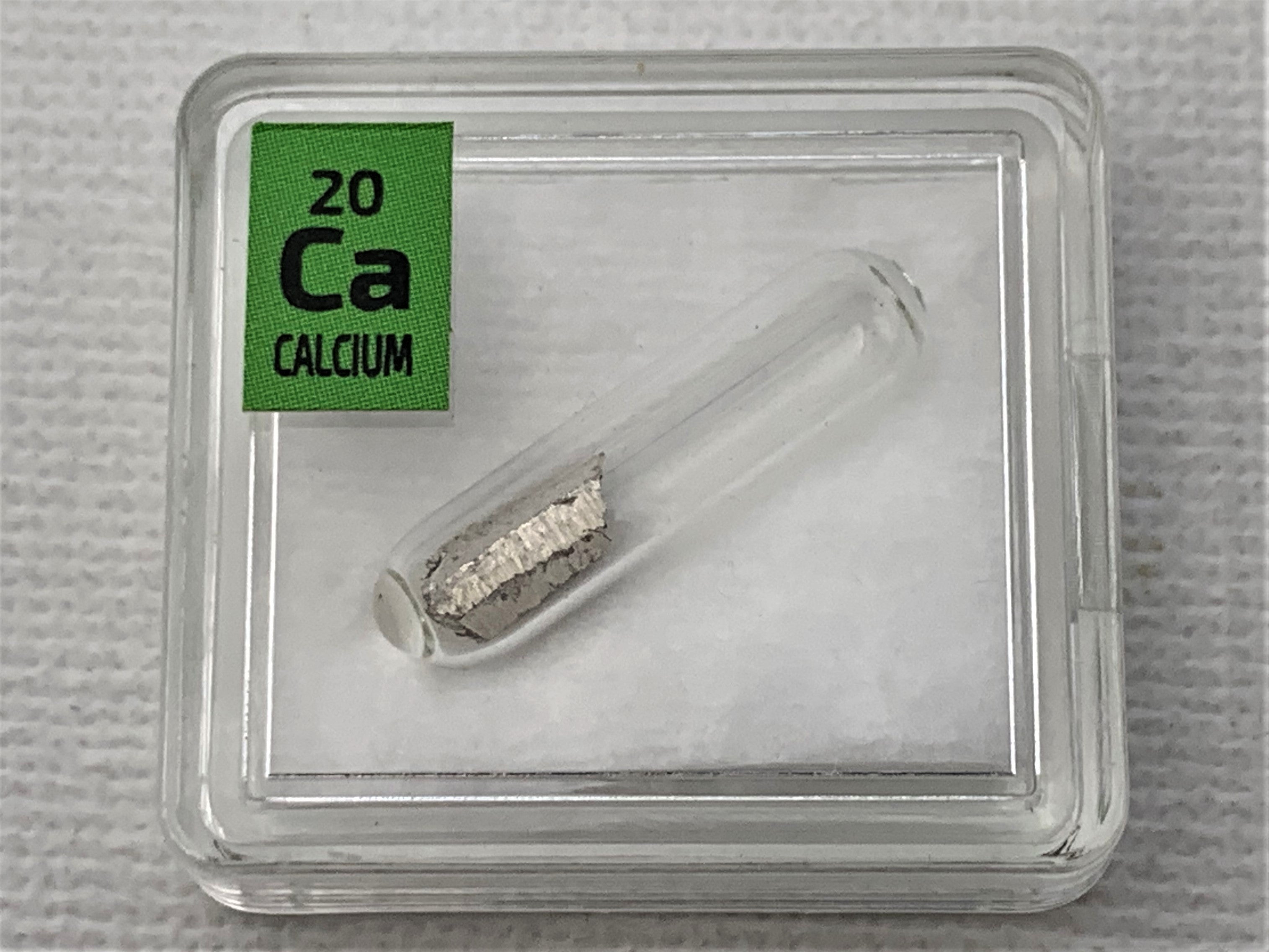 Calcium Metal in Glass ampoule under argon, Clean and Shiny 99.99% in a Periodic Element Tile