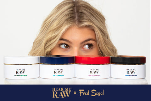 Women peering over HEAR ME RAW x Fred Segal Collection