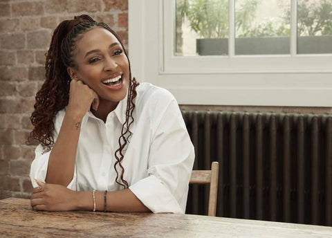 Alexandra Burke sitting at dining table