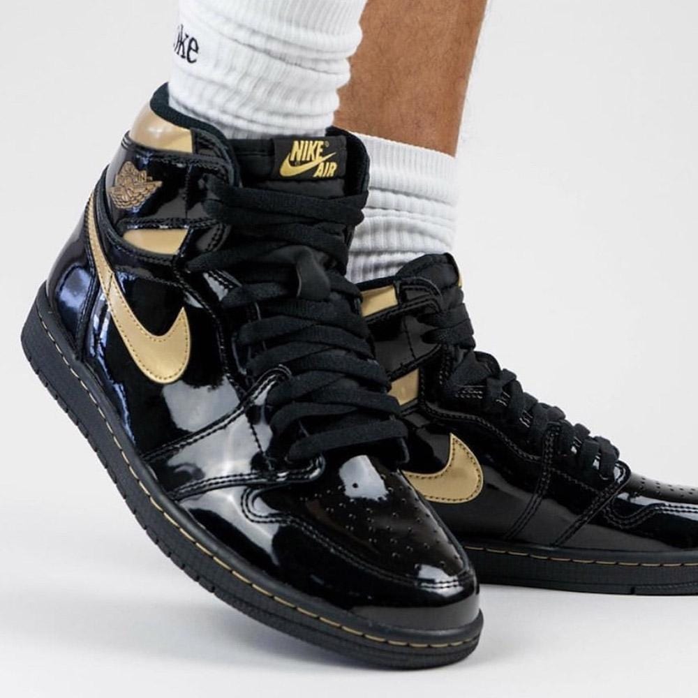 black air jordans with gold