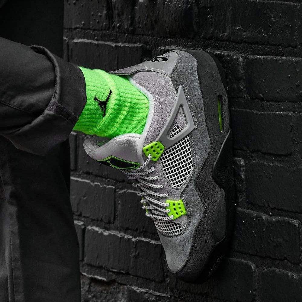 grey jordan 4 neon