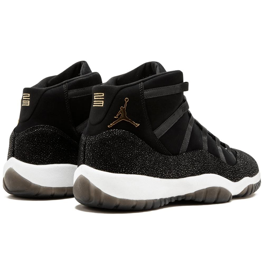 gold and black jordans 11