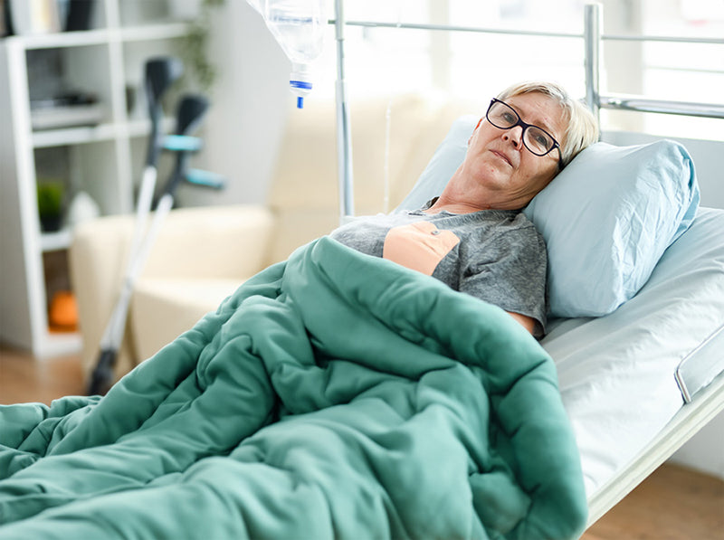 a weighted blanket comforts patients during medical procedures