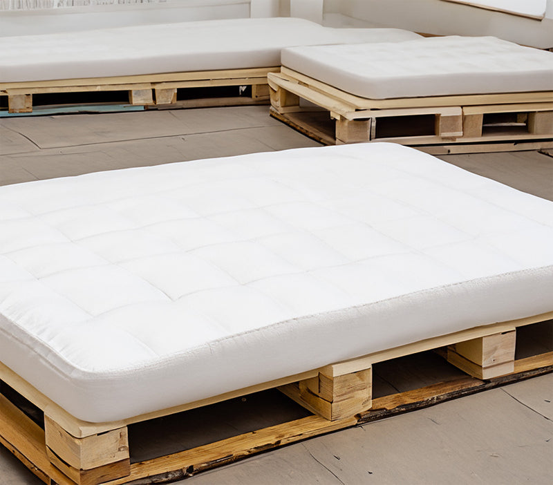 place your mattress on a flat, elevated surface, such as wooden pallets or a sturdy platform