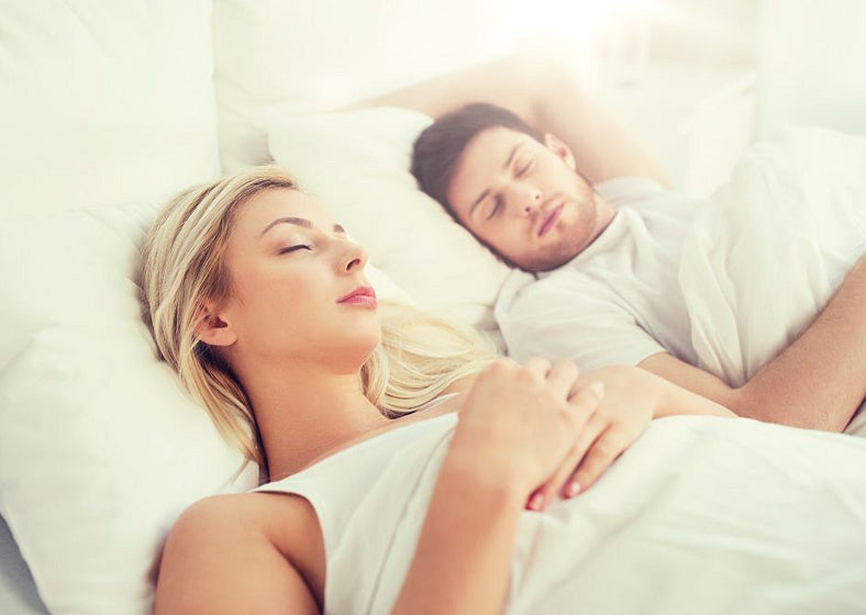 Couple sleeping on a GOLS certified organic latex mattress