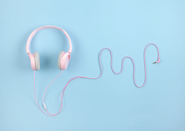 pink headphones on a blurred background