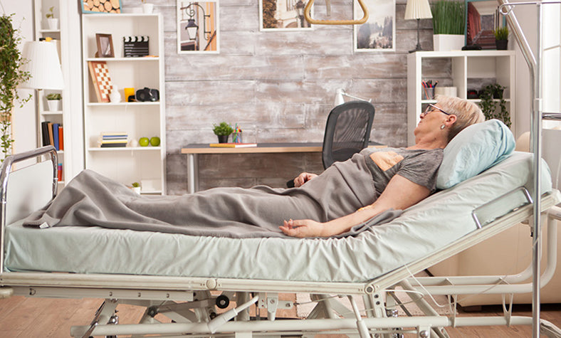 a person sleeping on an adjustable base bed