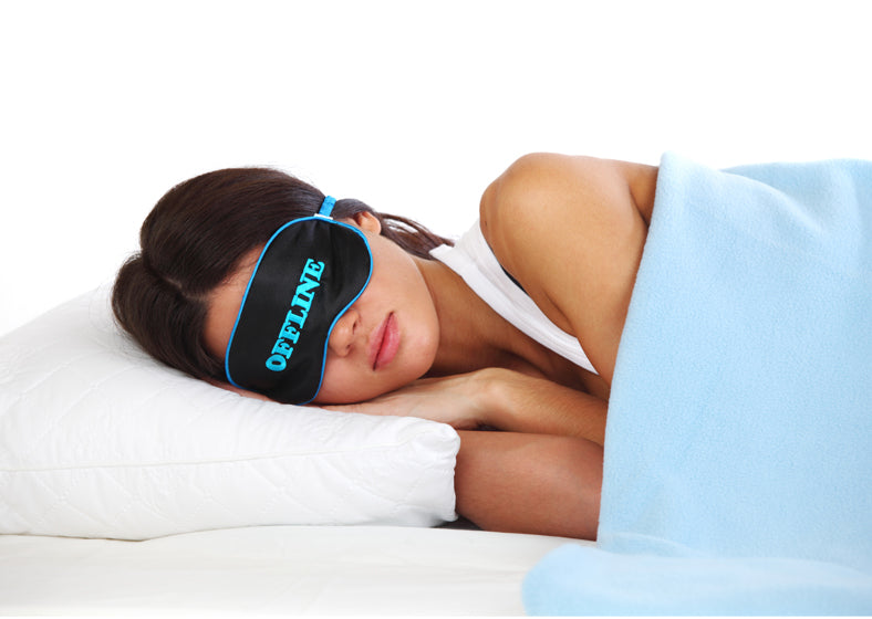 a girl sleeping with eye mask on.