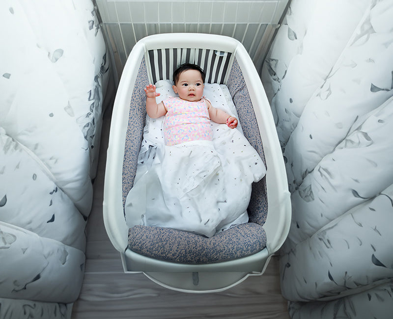 baby in a crib mattress
