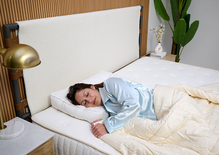 customer sleeping on a turmerry wool neck contour pillow