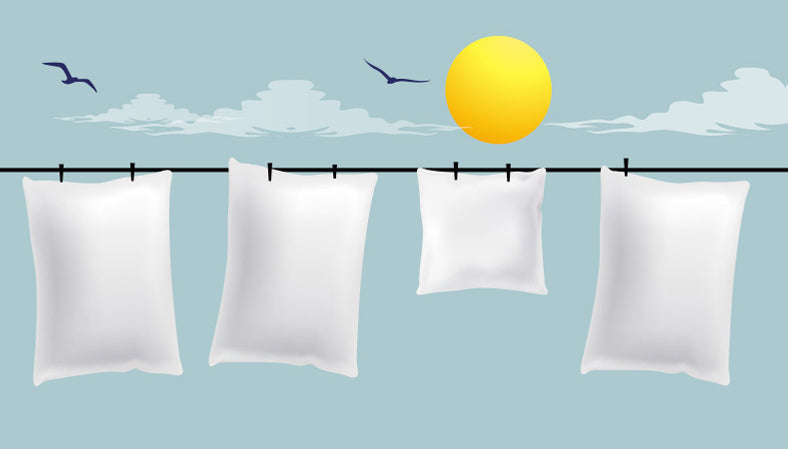 Hang your pillows outdoors on a clothesline a few hours to keep them looking fresh