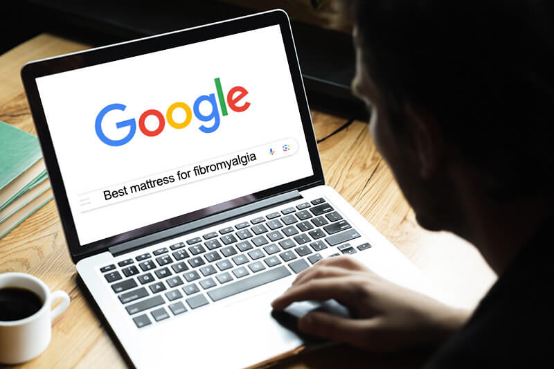 a man googling Best mattress for fibromyalgia