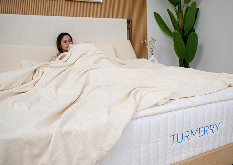 customer sleeping with organic chenille herringbone blanket and throw