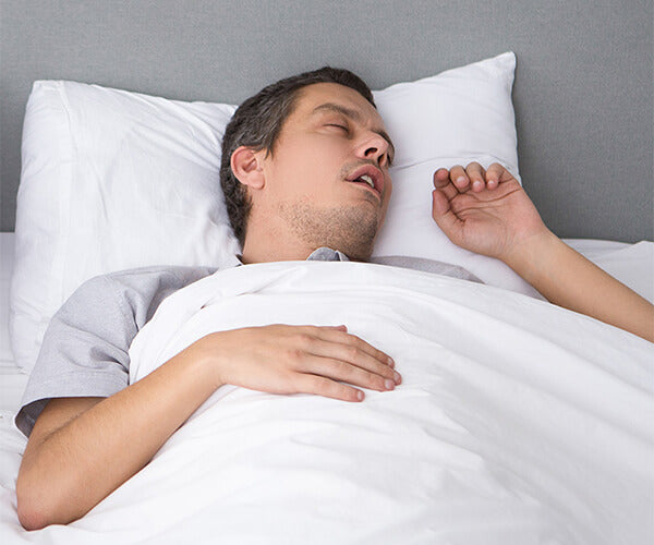 a person snoring while sleeping