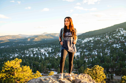 woman looking into the distance on a mountain