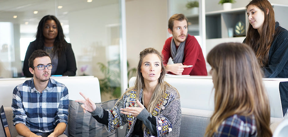 Adults in discussion about where to buy CBD roll on for pain relief.