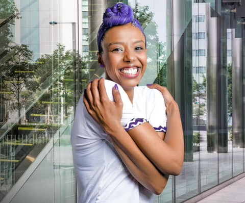 Women hugging herself to symbolise Embrace Equity - the 2023 IWD theme