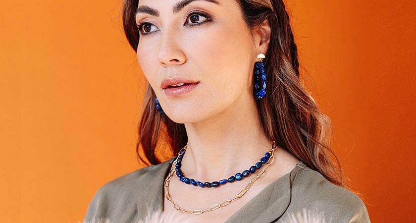 Neomi lapis lazuli stone necklace and earrings on model