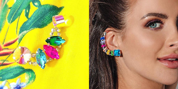 Colourful crystal ear climbers Heather on yellow background Billie on right ear of smiling model