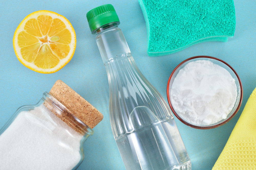 Eco-friendly natural cleaners. Vinegar, baking soda, salt, lemon and cloth. Homemade green cleaning.