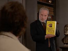 therapist from What About Bob with book Baby Steps