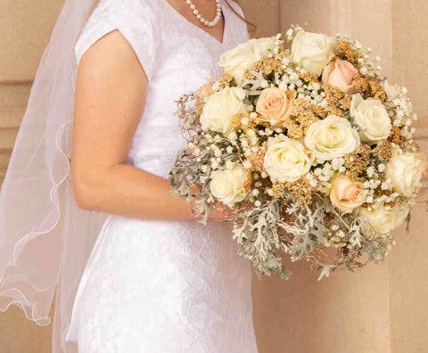 A bride in a stunning wedding gown, radiating elegance and joy on her special day, symbolizing love and commitment.