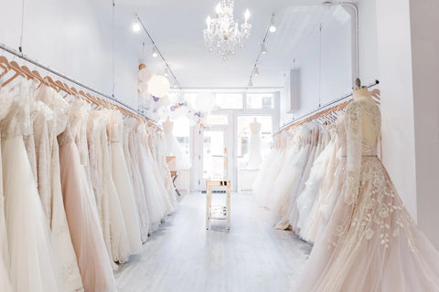 A wedding dress boutique showcasing a variety of luxury boho wedding dresses.