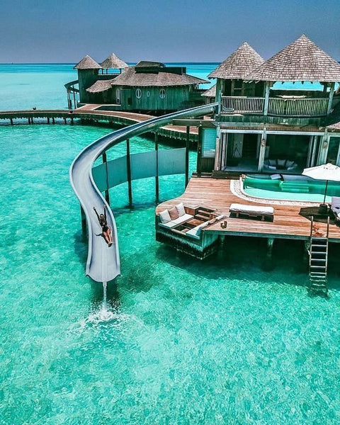 Maldives tropical resort with water slide on the ocean