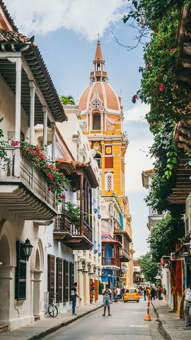 Cartagena town with pedestrians and yellow tower