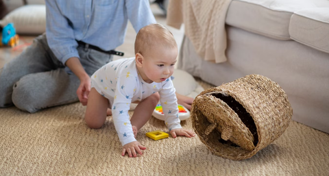 A Baby Boy Crawling On The Floor