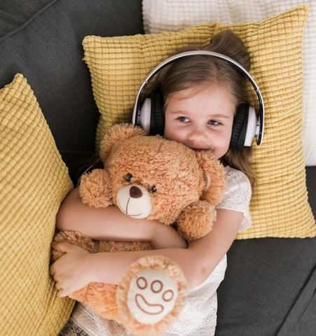 A Baby Girl Listening To Music